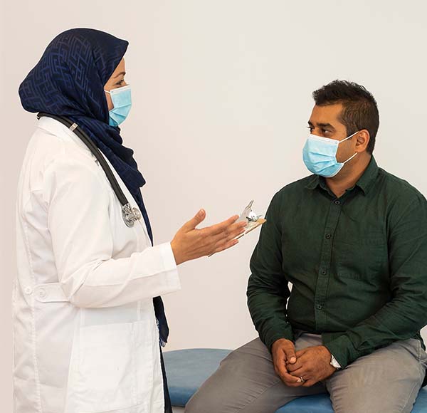 Decorative image of a physician interacting with a patient